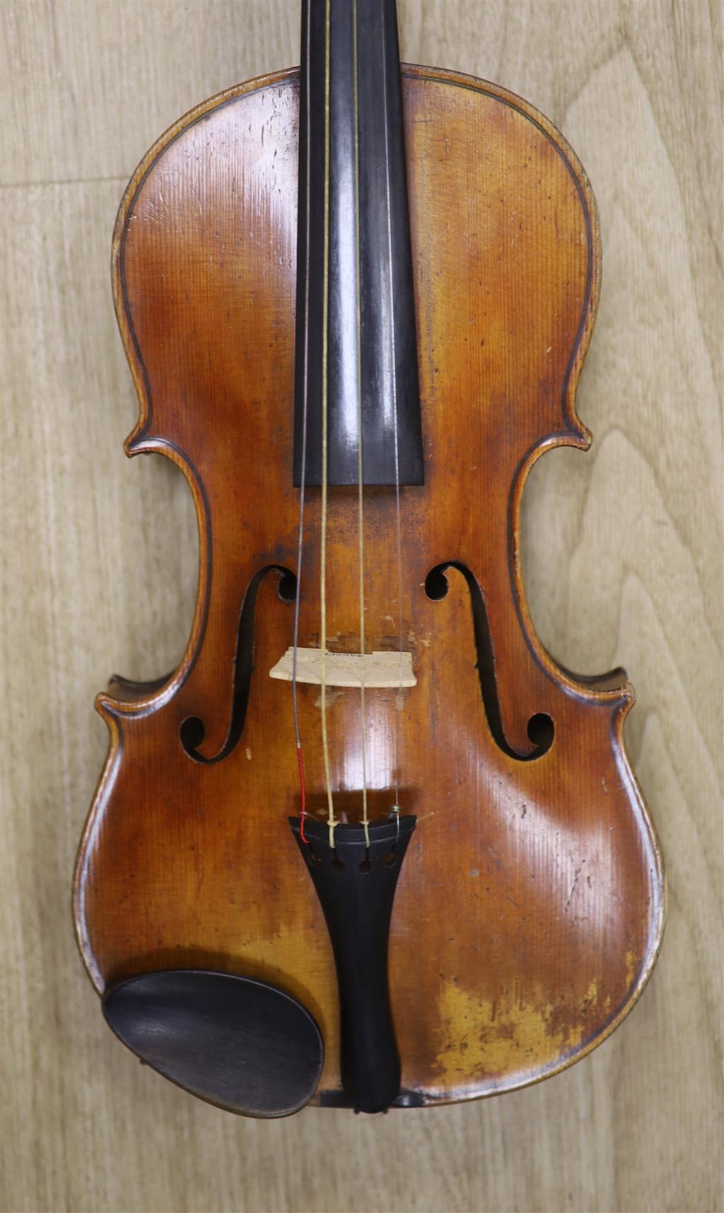 A late 19th century violin and a bow, cased
